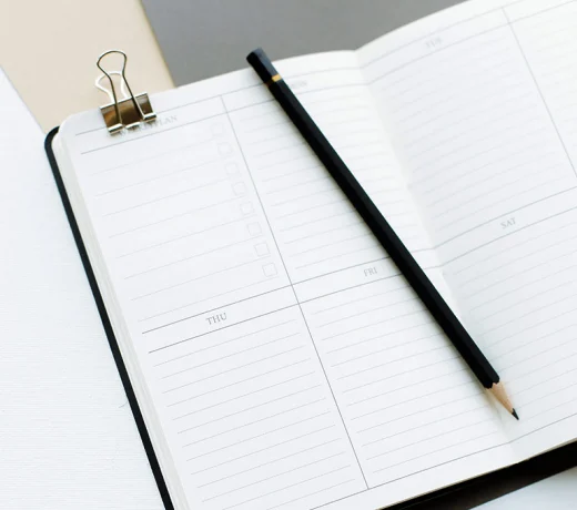 Notebook and pencil on desk